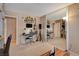 Bonus room with musical instruments, a keyboard, TV and large mirror at 611 Spyglass Ln, Las Vegas, NV 89107