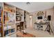 Bonus room featuring built-in shelving, a keyboard and guitar at 611 Spyglass Ln, Las Vegas, NV 89107