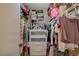 Well-organized walk-in closet featuring shelving, drawers, and ample hanging space for clothing and accessories at 611 Spyglass Ln, Las Vegas, NV 89107