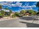 Welcome to The Greens, an exclusive community with lush landscaping and guarded entry at 611 Spyglass Ln, Las Vegas, NV 89107