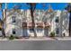 Charming exterior view of townhouses showcasing unique architectural details and curb appeal at 611 Spyglass Ln, Las Vegas, NV 89107