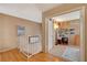Hallway with wood floors leads to a room with a desk and chair at 611 Spyglass Ln, Las Vegas, NV 89107