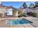 Inviting in-ground hot tub within a fenced area with easy access and poolside seating at 611 Spyglass Ln, Las Vegas, NV 89107