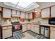 A cozy kitchen features white cabinets and essential appliances for easy meal preparation at 611 Spyglass Ln, Las Vegas, NV 89107