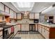 A cozy kitchen features white cabinets and essential appliances for easy meal preparation at 611 Spyglass Ln, Las Vegas, NV 89107