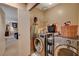 Modern laundry room with front-loading washer and dryer, plus storage at 611 Spyglass Ln, Las Vegas, NV 89107