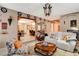 Bright living room with comfortable seating and an open doorway at 611 Spyglass Ln, Las Vegas, NV 89107