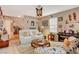 Bright living room featuring staircase, shelving, and an open doorway at 611 Spyglass Ln, Las Vegas, NV 89107