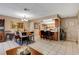 Spacious living area showcases an open-concept dining area leading to the stylish kitchen at 611 Spyglass Ln, Las Vegas, NV 89107