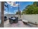 Private patio area with an outdoor table set and a barbecue grill, perfect for entertaining at 611 Spyglass Ln, Las Vegas, NV 89107