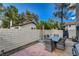Enjoy the outdoors on this charming patio, featuring a table set and view to the backyard at 611 Spyglass Ln, Las Vegas, NV 89107