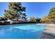Community swimming pool with sparkling blue water at 611 Spyglass Ln, Las Vegas, NV 89107