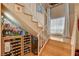 Staircase featuring a window, decor, and wine rack at 611 Spyglass Ln, Las Vegas, NV 89107