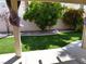 Backyard featuring mature landscaping and artificial turf at 6508 Alpine Forest Ct, Las Vegas, NV 89149