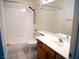 Standard bathroom with shower over tub, tile surround, and single sink vanity at 6508 Alpine Forest Ct, Las Vegas, NV 89149