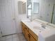 Bathroom featuring double sinks and wood cabinets at 6508 Alpine Forest Ct, Las Vegas, NV 89149