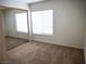 Bedroom boasts a mirrored closet and neutral carpeting throughout at 6508 Alpine Forest Ct, Las Vegas, NV 89149
