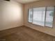 A standard carpeted bedroom with a window and mini-blinds at 6508 Alpine Forest Ct, Las Vegas, NV 89149
