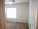 Bedroom features neutral carpeting, a ceiling fan, and a standard closet at 6508 Alpine Forest Ct, Las Vegas, NV 89149