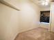 Bedroom features neutral carpeting, standard closet, and a ceiling fan at 6508 Alpine Forest Ct, Las Vegas, NV 89149
