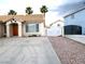 Charming single-story home featuring a well-maintained front yard, concrete driveway and tile roof at 6508 Alpine Forest Ct, Las Vegas, NV 89149
