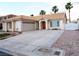 Lovely single-story home featuring a spacious driveway, two-car garage, tile roof, and well-maintained landscaping at 6508 Alpine Forest Ct, Las Vegas, NV 89149