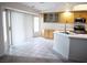 Open concept kitchen and breakfast nook featuring tile flooring and bright natural light at 6508 Alpine Forest Ct, Las Vegas, NV 89149