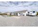 Spacious backyard with gravel landscaping, RV parking, and storage shed at 681 Indian Wells Ct, Pahrump, NV 89060