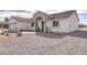 Well-maintained home featuring neutral-toned exterior and low-maintenance gravel yard at 681 Indian Wells Ct, Pahrump, NV 89060