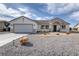 Charming single-story home with gravel landscaping and a two-car garage at 681 Indian Wells Ct, Pahrump, NV 89060