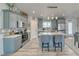 Modern kitchen featuring stainless steel appliances and an island with seating at 681 Indian Wells Ct, Pahrump, NV 89060