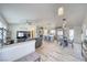 Open-concept living space with contemporary decor and wood-look flooring at 681 Indian Wells Ct, Pahrump, NV 89060