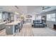 Inviting living space showcasing a well-lit open floor plan with kitchen access at 681 Indian Wells Ct, Pahrump, NV 89060