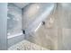 Walk-in shower with stylish gray tiles and a built-in bench at 681 Indian Wells Ct, Pahrump, NV 89060