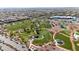 An aerial view of a community park, with walking trails, open green spaces, and playground equipment at 7364 Marbury St, Las Vegas, NV 89166