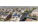 Modern two-story home with solar panels and a balcony, situated in a neighborhood with mountain views at 7364 Marbury St, Las Vegas, NV 89166