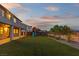 Large backyard with artificial turf, a playset, and covered patio, great for entertaining at 7364 Marbury St, Las Vegas, NV 89166