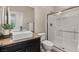 Modern bathroom with a sleek vanity, a shower, and neutral color scheme, offering elegance at 7364 Marbury St, Las Vegas, NV 89166