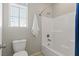 Well-lit bathroom featuring a tub and shower combo with a curved shower rod at 7364 Marbury St, Las Vegas, NV 89166