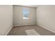 Neutral bedroom with carpeted floor, a window, and neutral walls, offering a blank canvas at 7364 Marbury St, Las Vegas, NV 89166