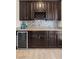 The butler's pantry features granite counters, a wine rack, and a beverage cooler at 7364 Marbury St, Las Vegas, NV 89166