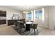 Bright dining area with modern furnishings and a large window with backyard views at 7364 Marbury St, Las Vegas, NV 89166