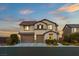 Beautiful two-story home featuring a three-car garage and landscaped front yard at 7364 Marbury St, Las Vegas, NV 89166