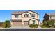 Attractive two-story home boasts a three-car garage, well-maintained landscaping, and a welcoming facade at 7364 Marbury St, Las Vegas, NV 89166