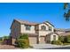 Two-story home showcases a three-car garage, manicured bushes, and an inviting entrance at 7364 Marbury St, Las Vegas, NV 89166