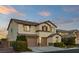 Inviting two-story home showcasing a two-car garage and well-maintained yard at 7364 Marbury St, Las Vegas, NV 89166