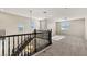 Upstairs landing featuring wood railing and neutral carpet at 7364 Marbury St, Las Vegas, NV 89166