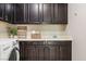Functional laundry room with ample cabinet space and modern washer and dryer at 7364 Marbury St, Las Vegas, NV 89166