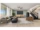 Spacious living room with modern decor, lots of natural light, and an open floor plan at 7364 Marbury St, Las Vegas, NV 89166