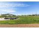 Scenic park with a shaded picnic area, expansive green lawns, and sports field for leisure and recreation at 7364 Marbury St, Las Vegas, NV 89166